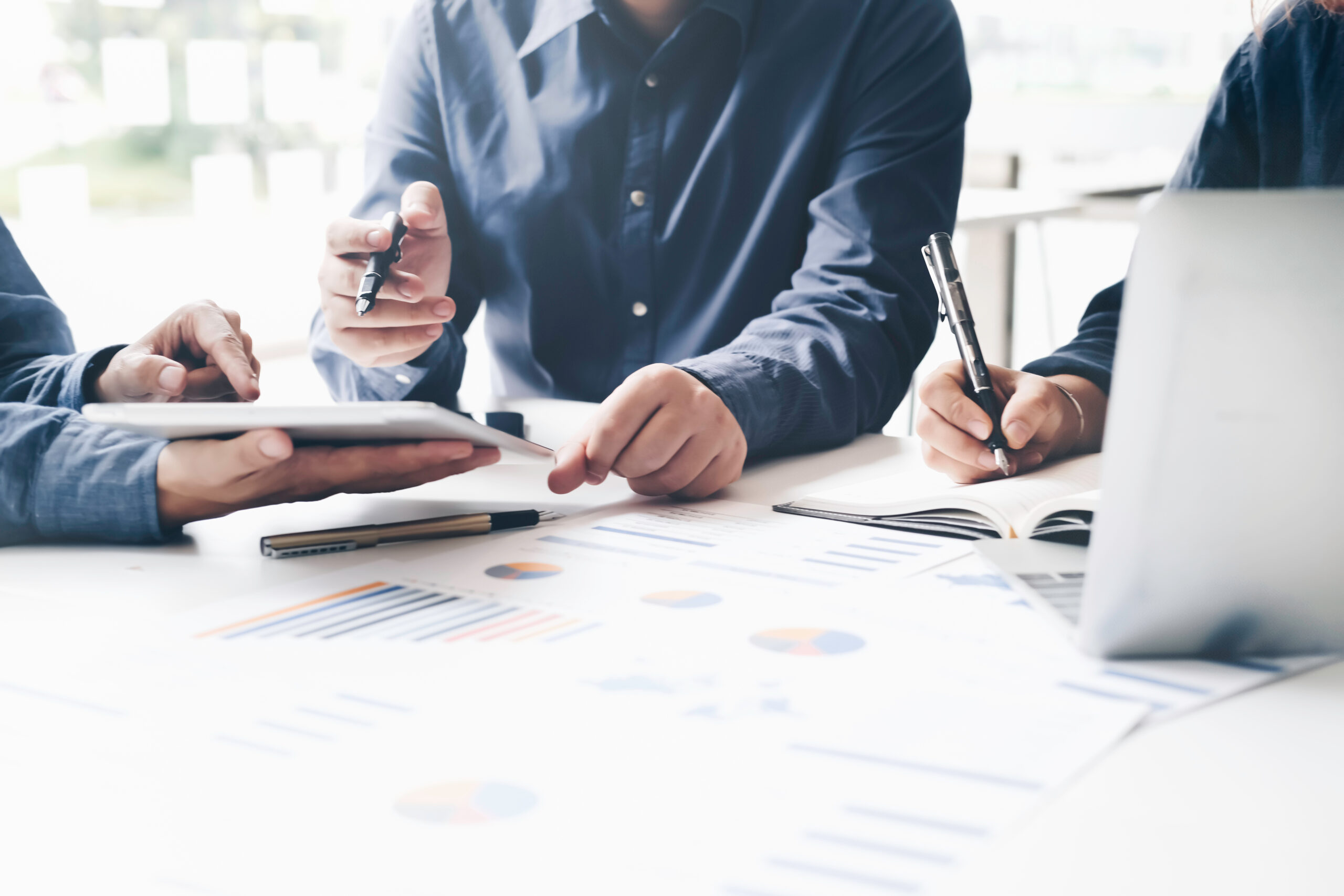 Asian business adviser meeting to analyze and discuss the situat